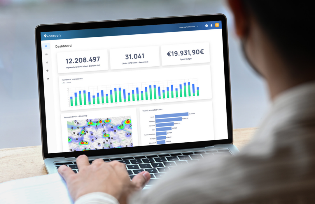 A user analyzing performance data on the 4screen marketing dashboard.